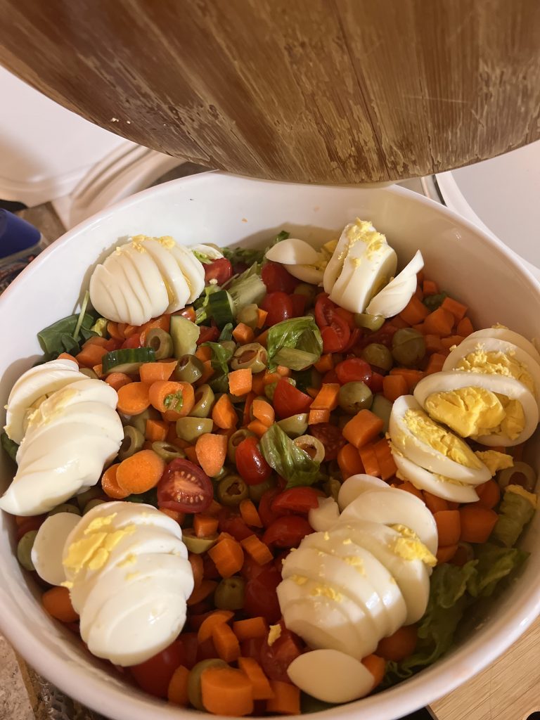 Large bowl of fresh salad prepared for nourishing support