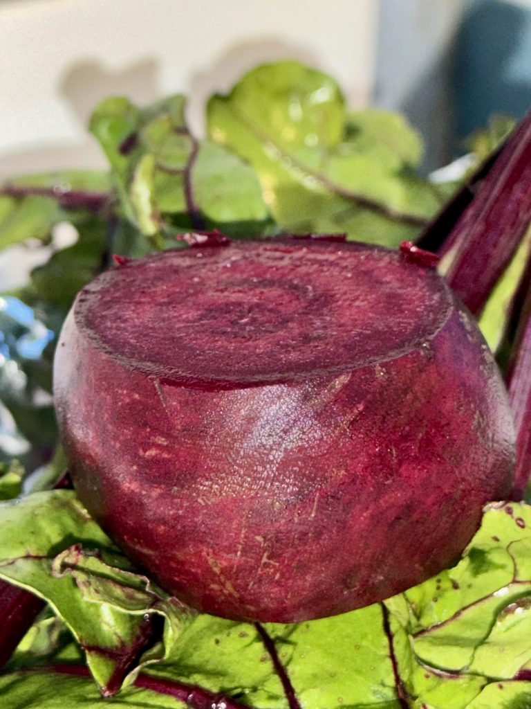 fresh beetroot with leafy greens representing grounding nourishment